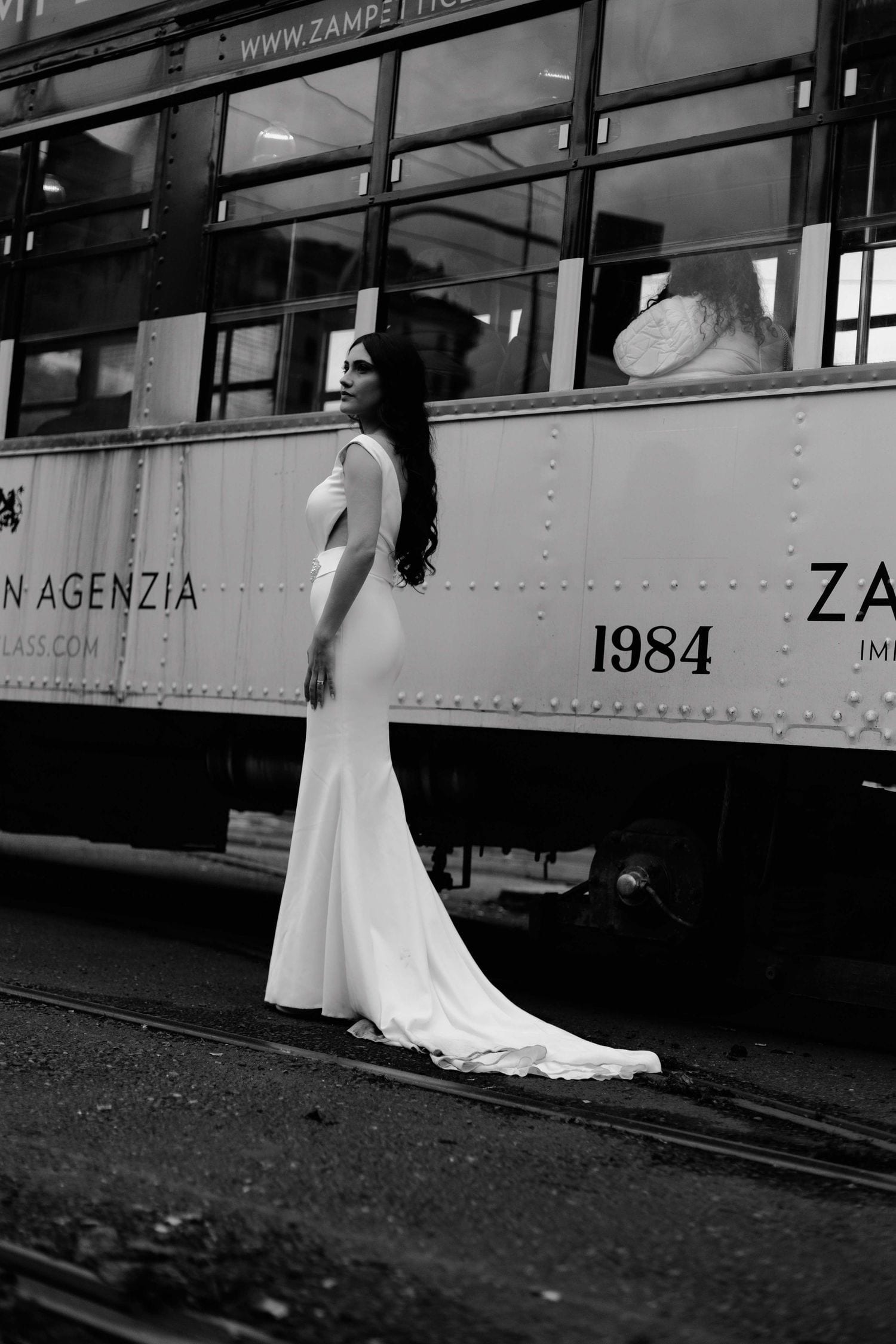 Grazia in an editorial portrait on a vintage Milan tram