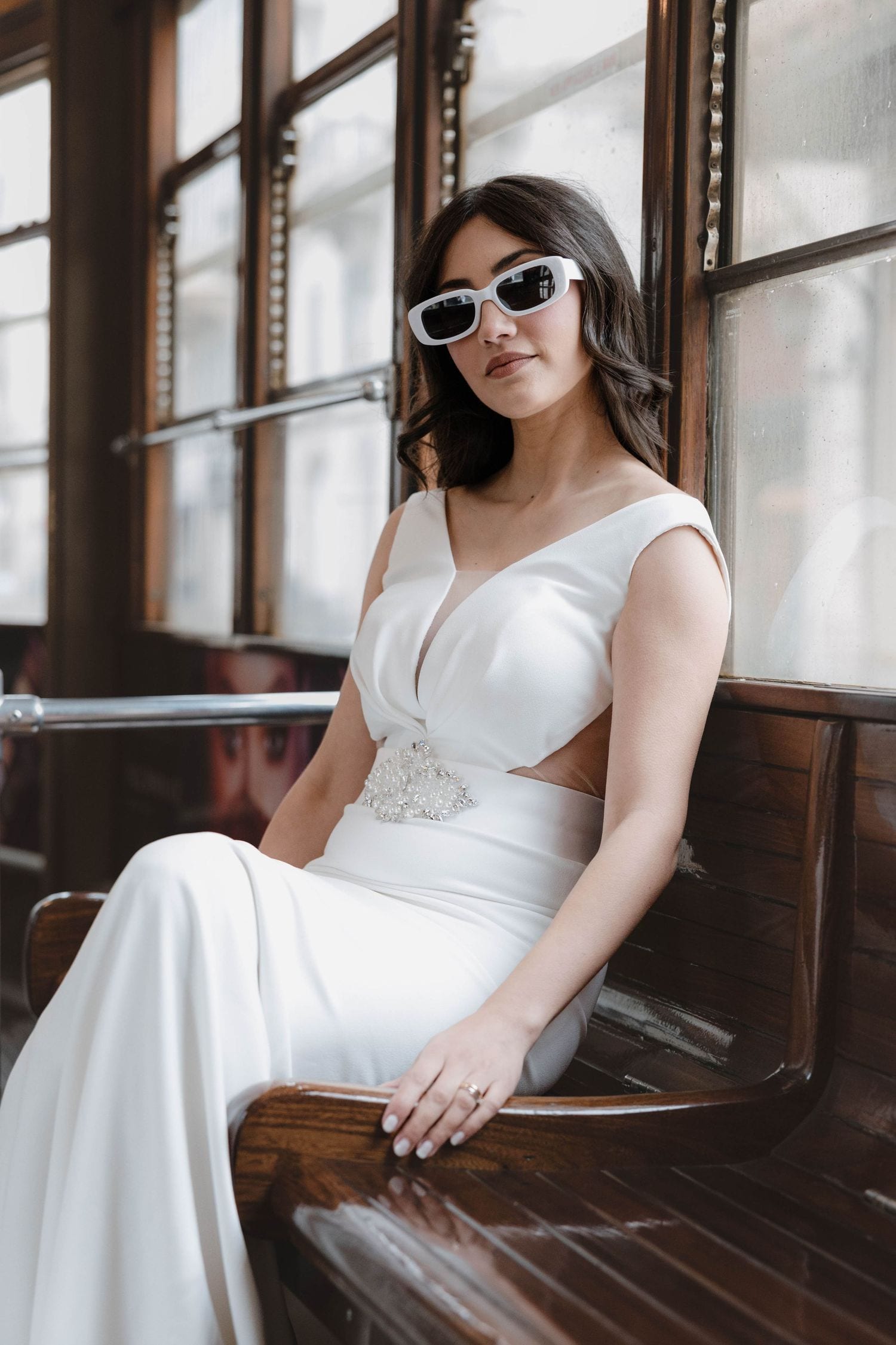 Quiet bridal portrait by the window during a Milan tram session