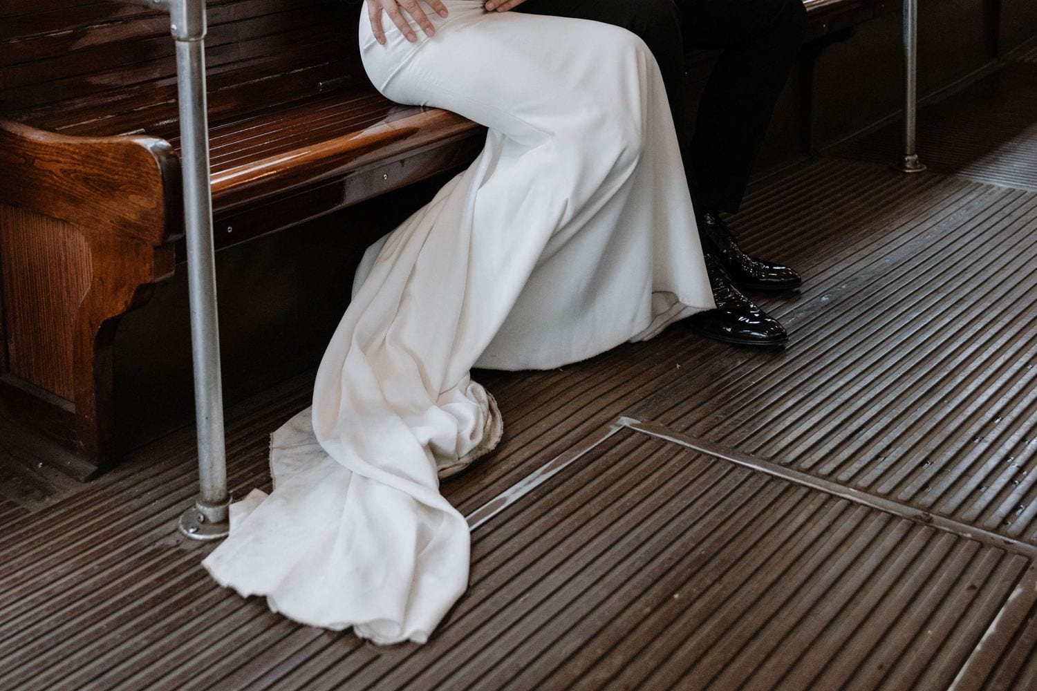 Black and white bridal detail inside a vintage Milan tram