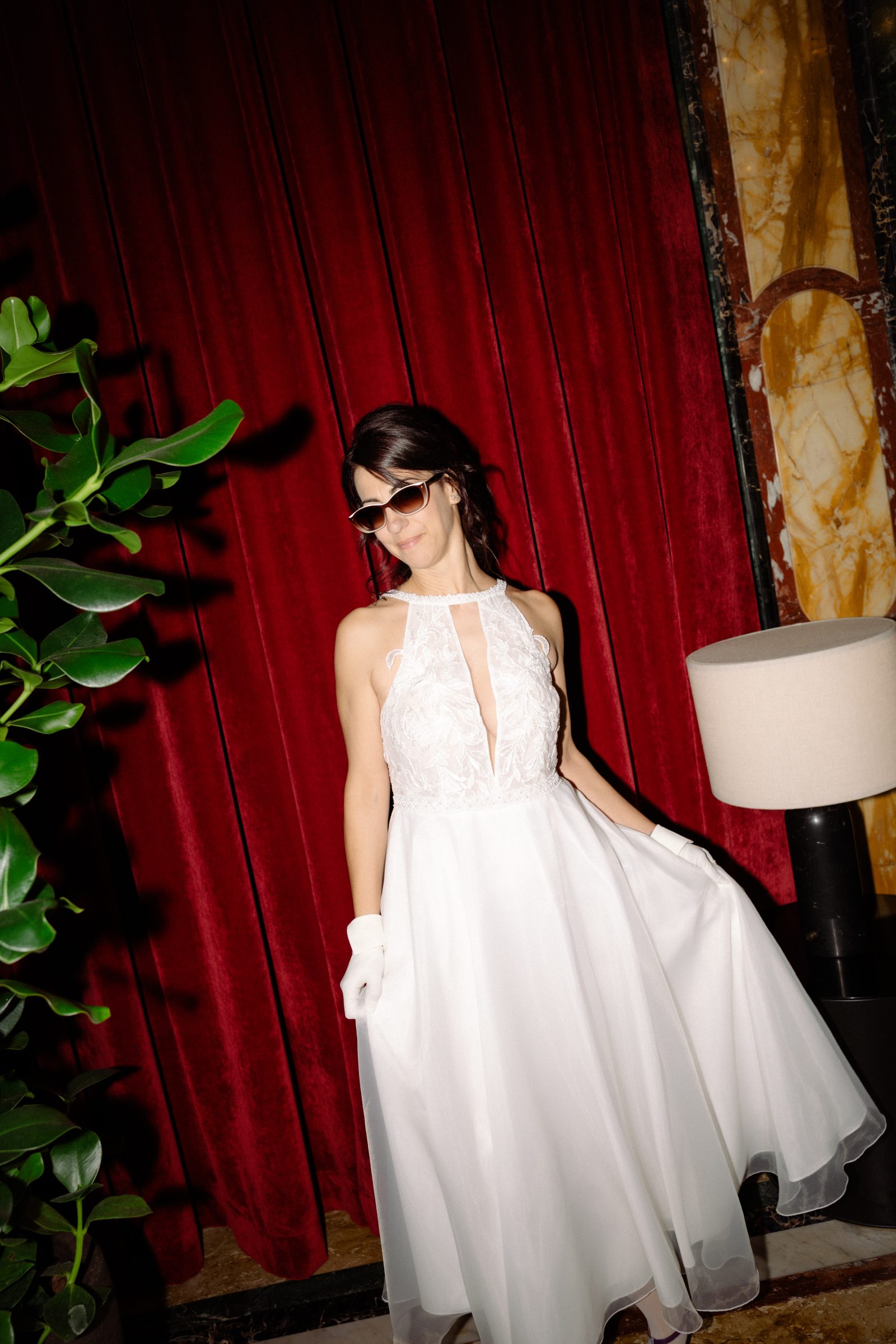 Editorial bridal portrait in the red room during a Venice wedding reception