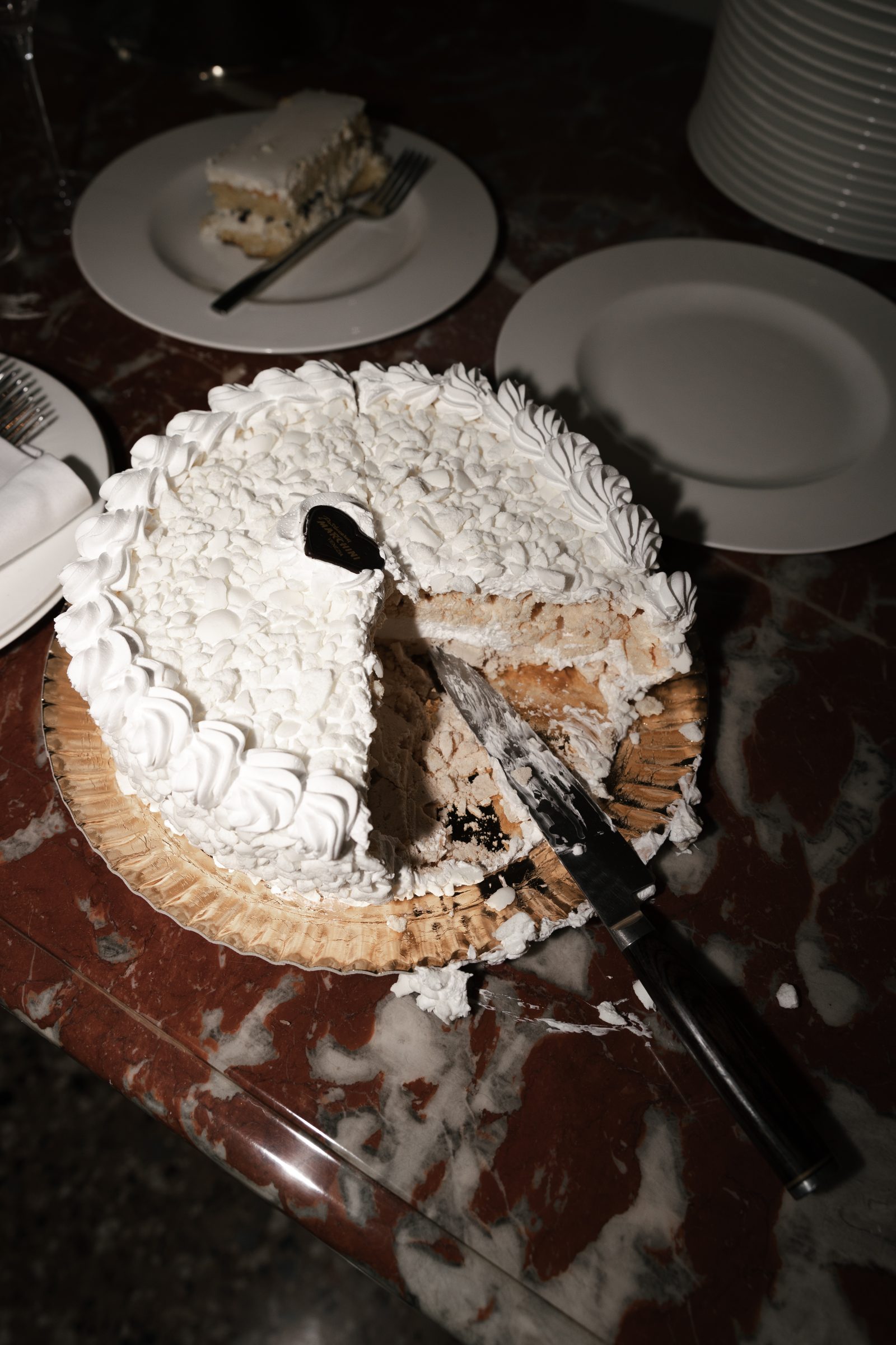 Wedding cake after cutting photographed with direct flash during the reception